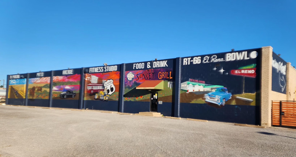 Route 66 stop in Oklahoma from RV overnights. Arcade, patio, fitness studio, RV parking, food, drink, bowling, and sunset grill.