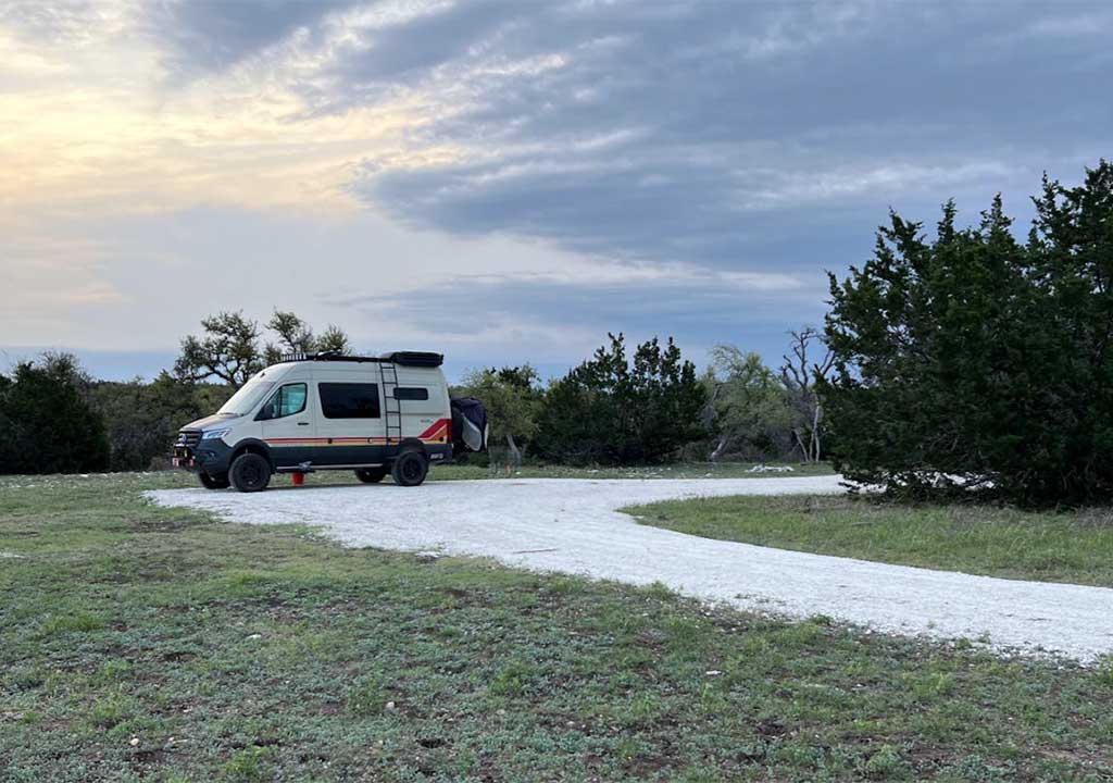 Camper vehicle on an empty dirt road